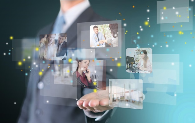 Man holding business elements icons on screen