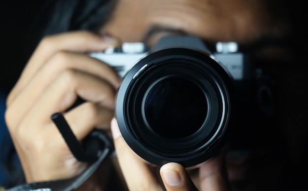 Man holding camera and taking photo