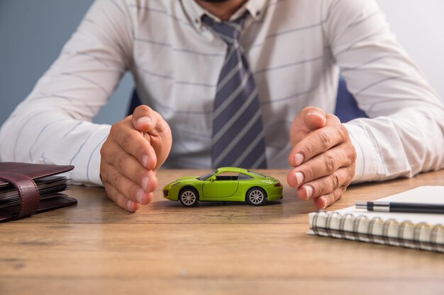 Man holding car model