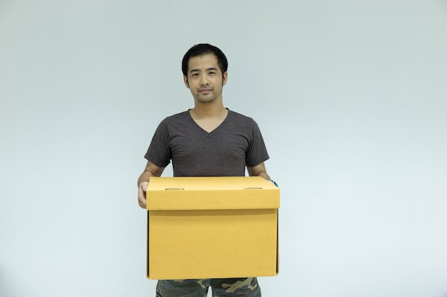 Man holding cardboard box in his hand