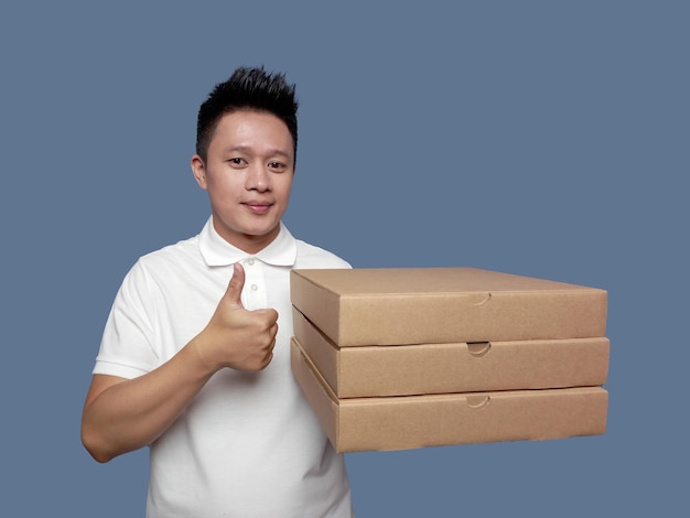 Man holding cardboard box with thumbs up gesture