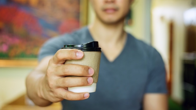 Man holding a cup of coffee