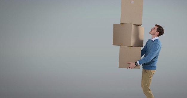 Man holding delivery boxes with grey background