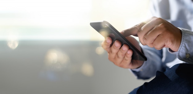 Man holding digital tablet in hands 