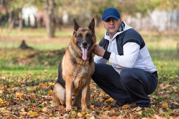 Man Holding Dog German Shepherd