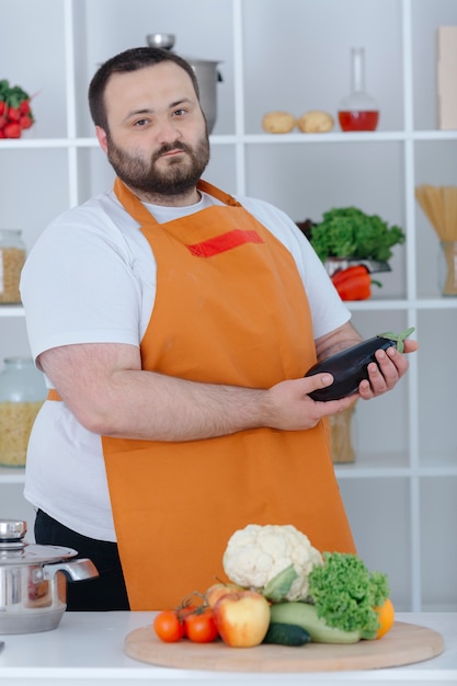 Man holding eggplant