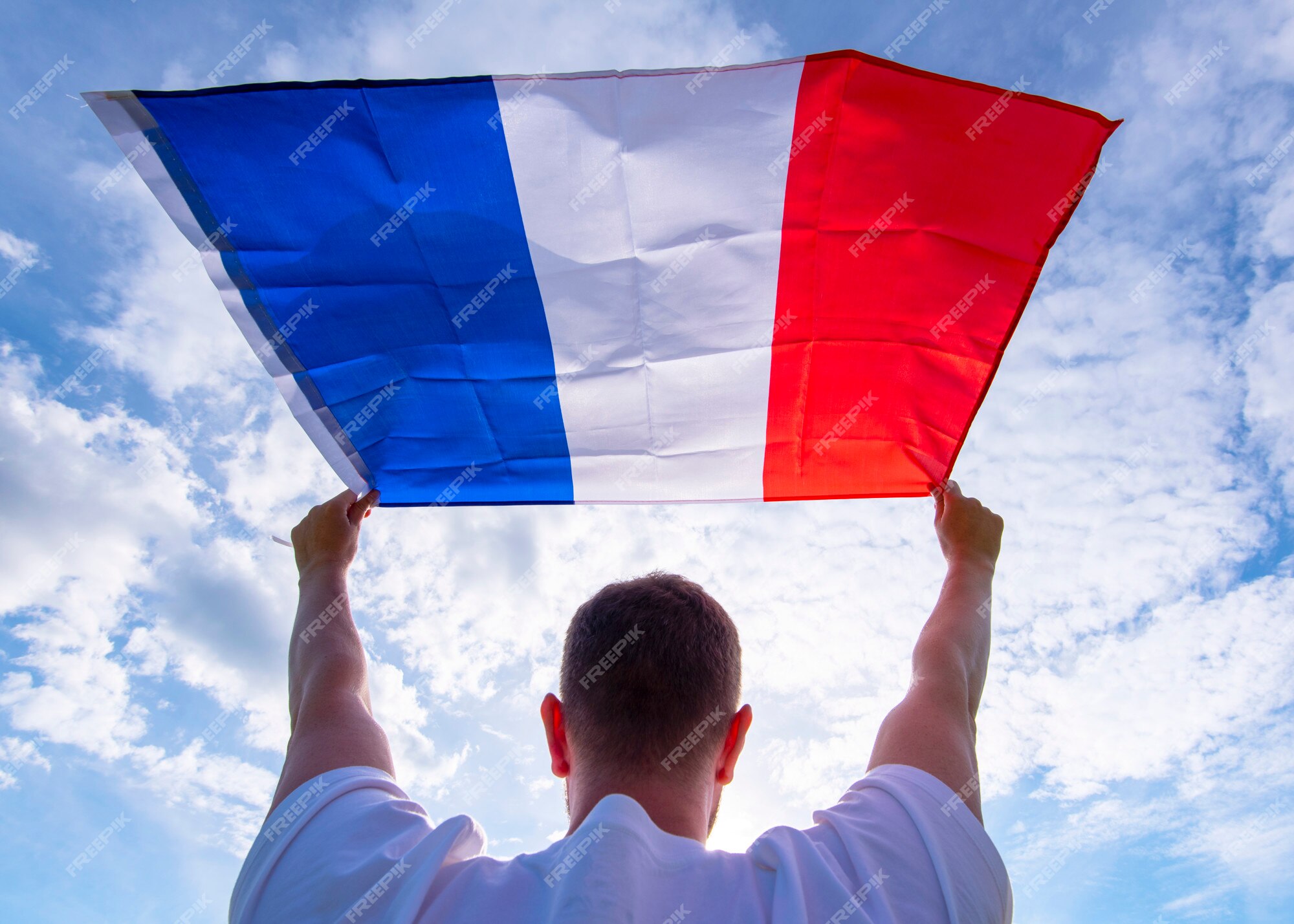 Man holding flag of france - Elite Digest