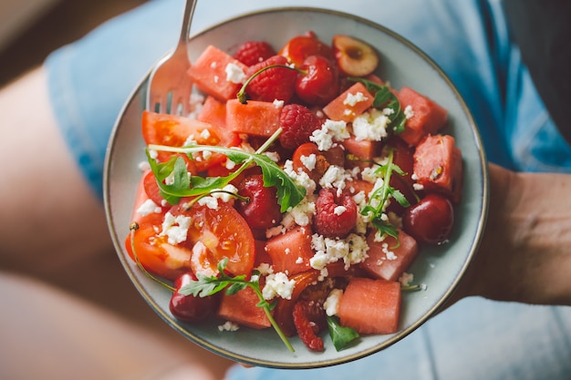 Man holding fresh healthy salad