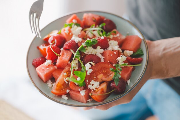 Man holding fresh healthy salad