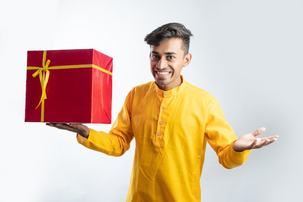 Man holding gift boxes during Diwali festival