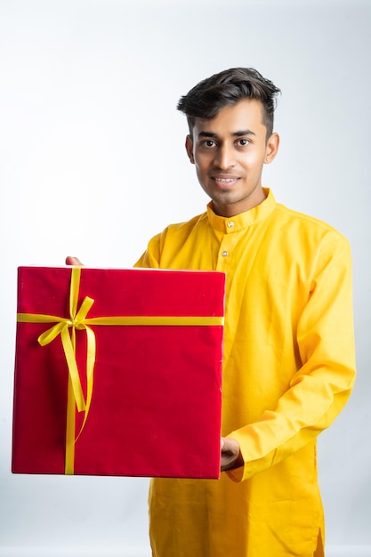 Man holding gift boxes during Diwali festival