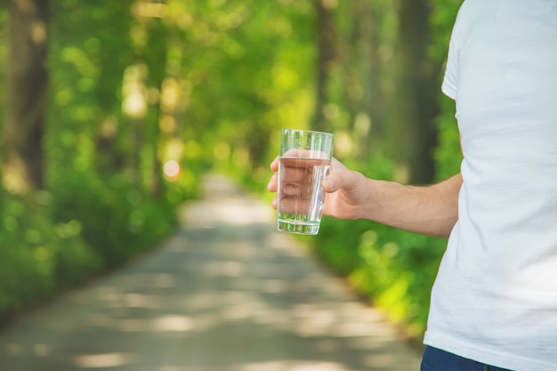 Man holding a glass of water