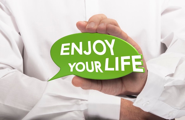 man holding a green bubble withe the text enjoy your life, farewell or goodbye message