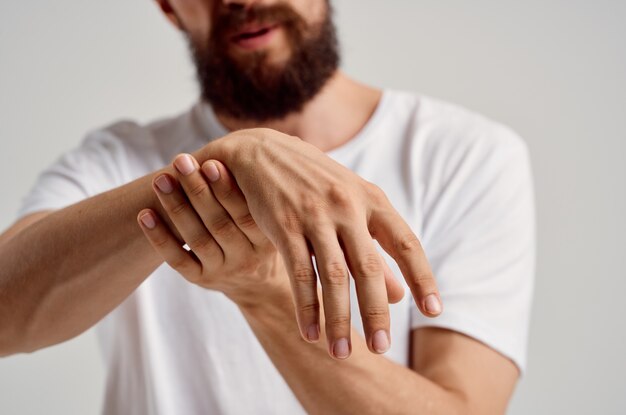 Man holding hand injury pain health problem