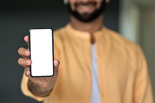 Man holding in hand showing white mock up phone screen\
cellphone ads template