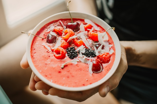 Man holding healthy smoothie bowl