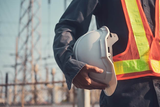 Man holding helmet,Person hold hard hat