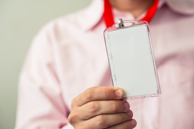 Photo man holding id card in his hand