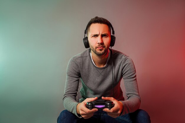 Photo man holding joystick and play virtual game