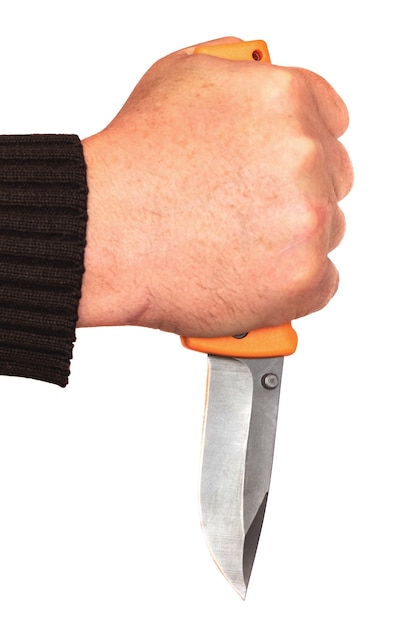 Man holding a knife in his hand on a white isolated background