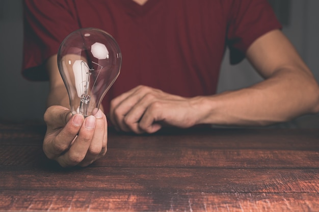 A man holding a light bulb