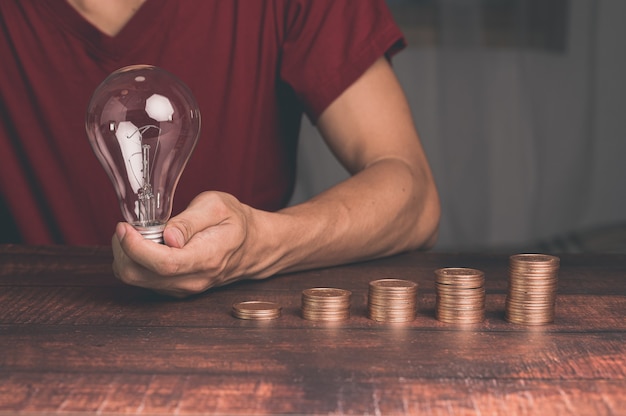 A man holding a light bulb