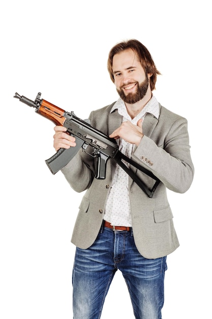 Photo man holding a machine gun isolated on white background