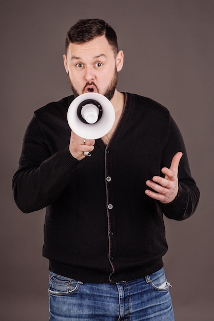 Man holding megaphone human emotion expression and lifestyle concept