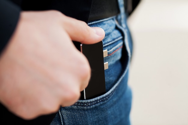 Man holding mini adapter for laptops and flash memory