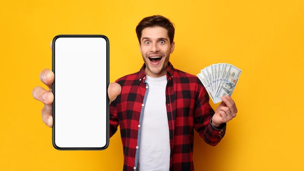 Man holding money and big white empty smartphone screen