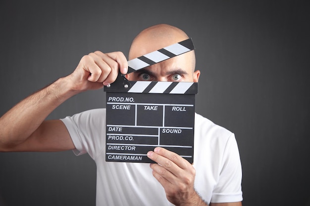 Man holding movie clapper Making movie