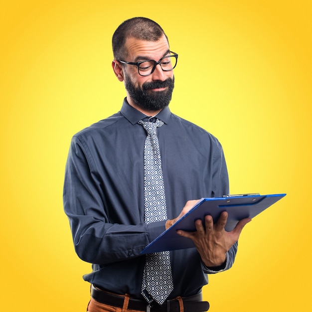 Man holding notes on colorful background