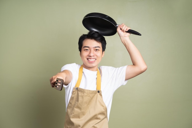 Man holding a pan on the background