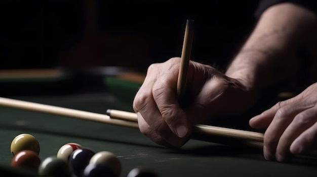 A man holding a pencil on a pool table with a pool cue.