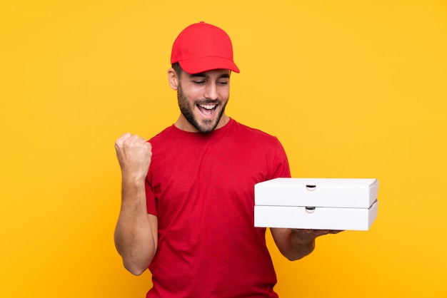 man holding pizzas boxes over isolated wall