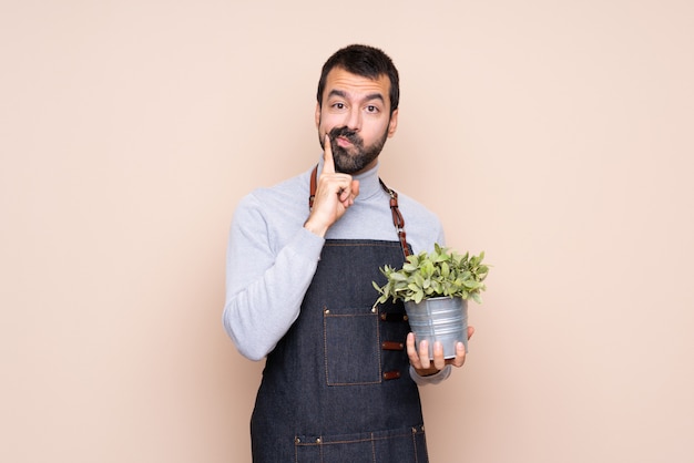 Man holding a plant Looking front