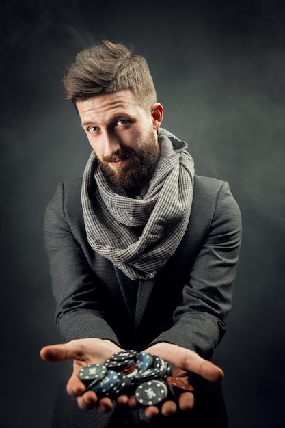 Man holding poker chips