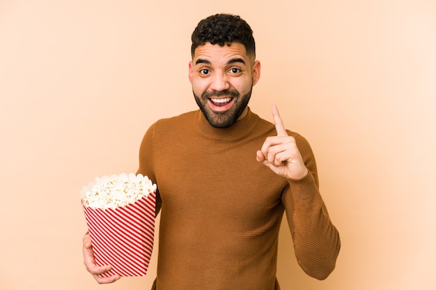 Man holding a popcorn bucket