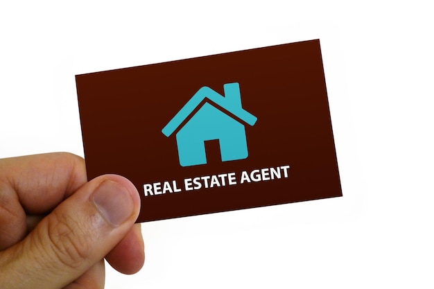 Man holding a real estate agent card