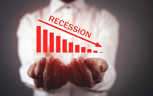 Man holding Recession graph. Business