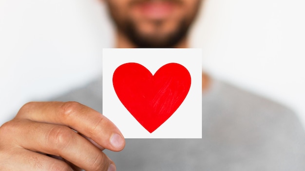 Man holding a red heart Romantic man Message Love The senses