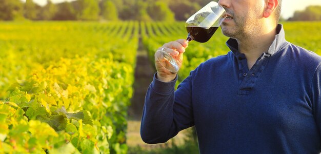 Man holding red wine glass