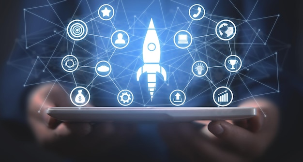 Man holding rocket with a business icons and network. Business. Startup