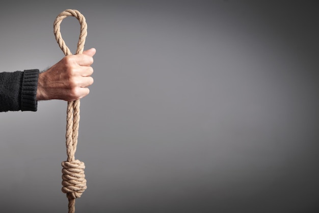 Man holding rope loop Suicide concept