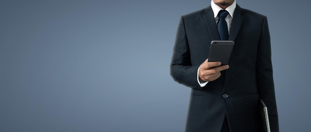 Man holding smartphone device and touching screen