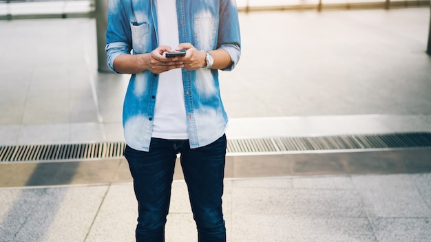 Man holding a smartphone. using cell phone on lifestyle. Technology for communication concept.