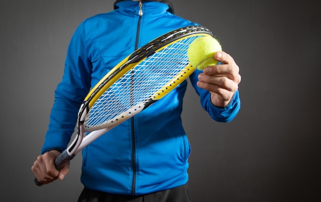 Man holding tennis ball and racket Sport Hobby