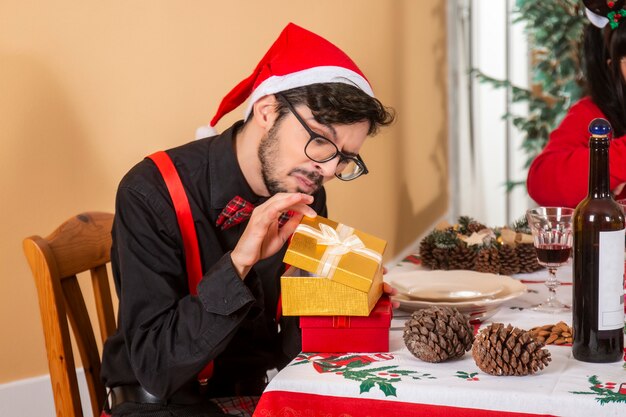 Man holding two gifts