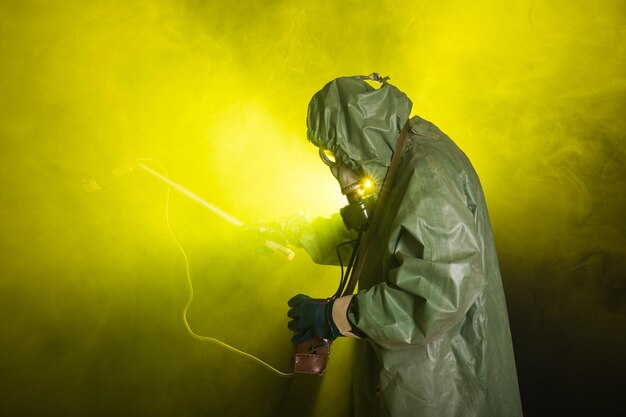 Man holding umbrella while standing against yellow background