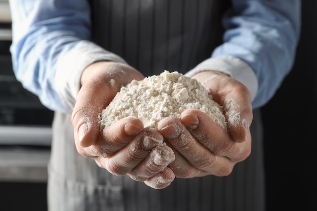 Man holding wheat flour closeup